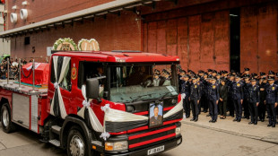Tears at tribute to firefighter killed in Hong Kong blaze