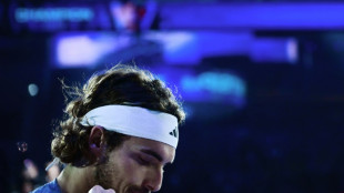 Tsitsipas quits ATP Finals with back injury