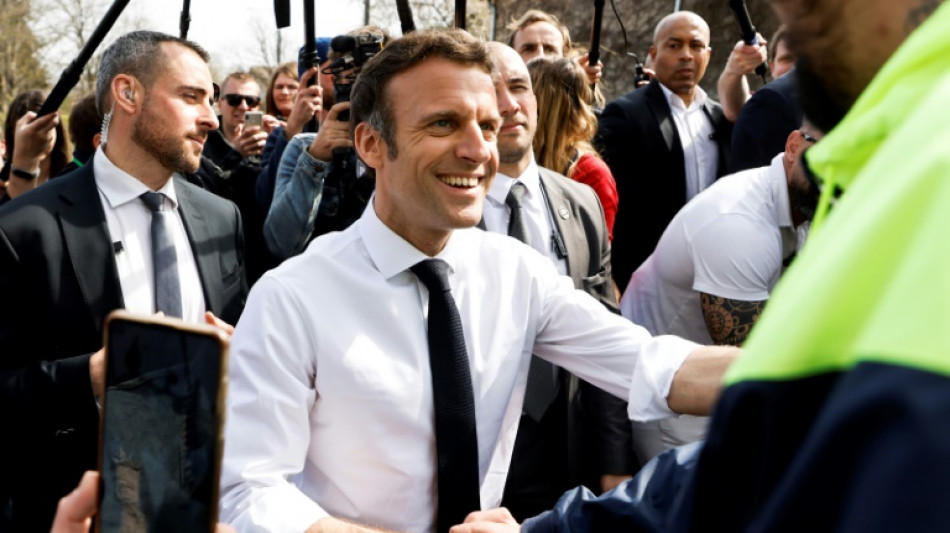 France's Macron hits back at rival over 'killer' chants 