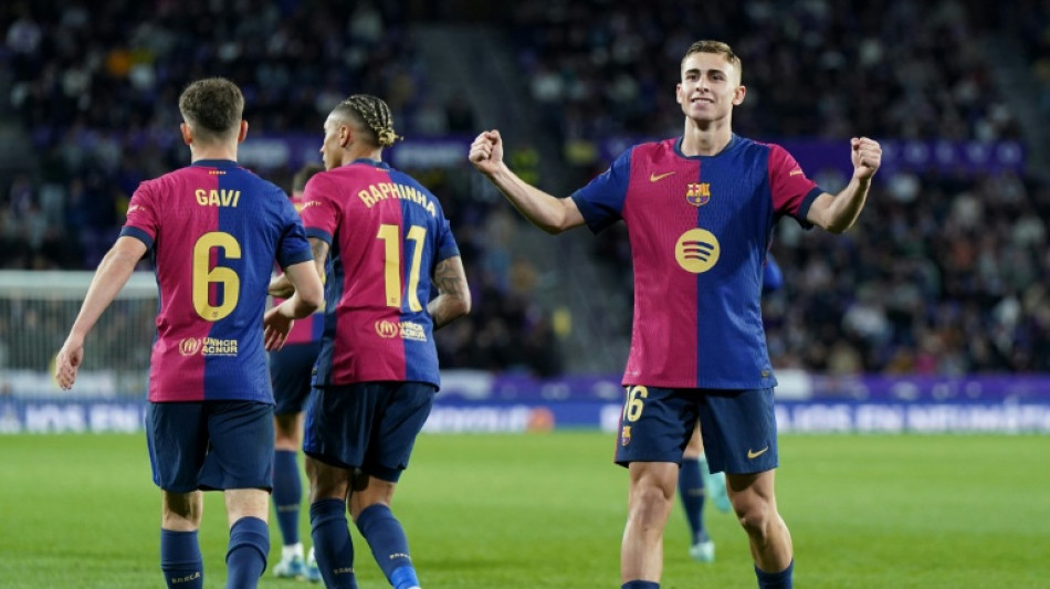 Barca battle back at Valladolid to preserve Liga title charge