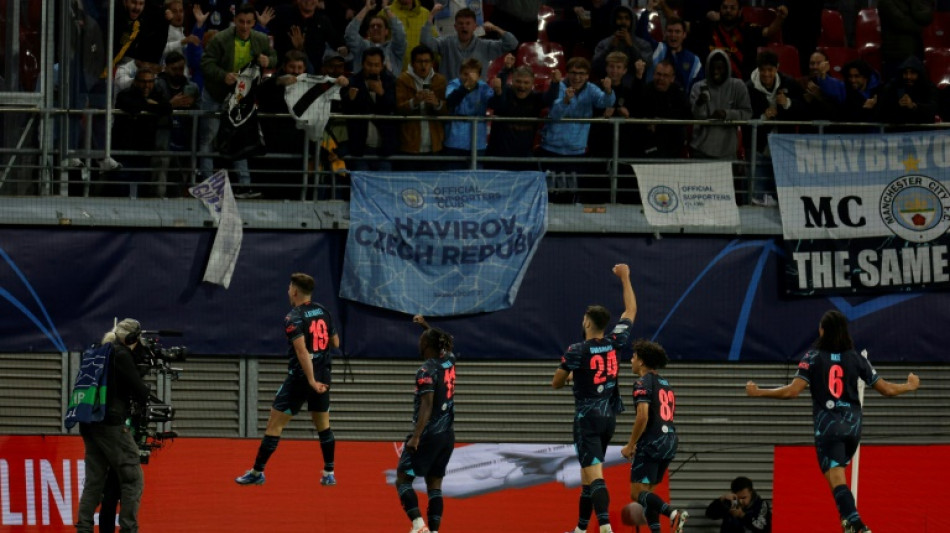 Alvarez and Doku strike late to push City past Leipzig