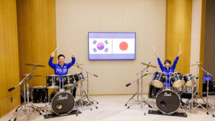 Japan, South Korea leaders drum up viral moment with K-pop jam