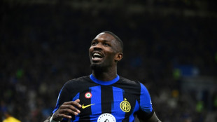 Thuram gives leaders Inter revenge on Lukaku as Napoli draw with Milan