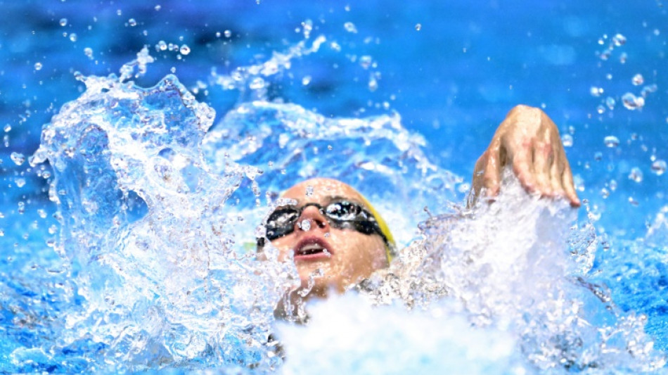 Australia's McKeown shatters 100m backstroke world record 