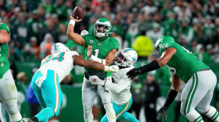 Eagles sink Dolphins, Patriots stun Bills in key NFL games
