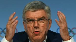 IOC president Bach coy as members call for rule change to extend his term